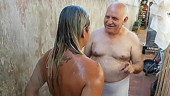 Amateur Grandpa And Young Girl Share A Steamy Bath On The Beach