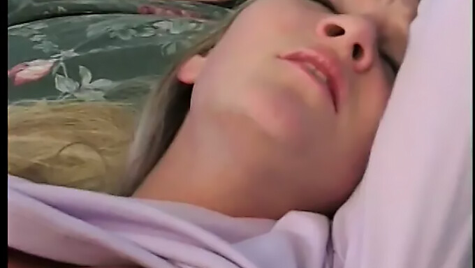 A stunning young blonde with adorable breasts receives a large penis inside her vagina